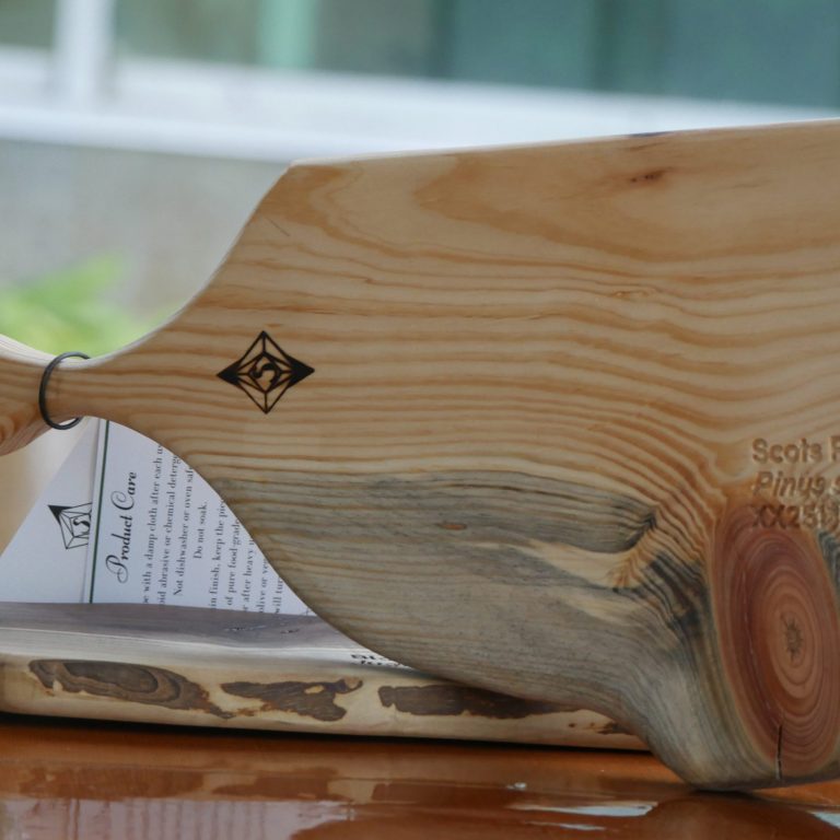 Handcrafted wooden board displayed standing upright