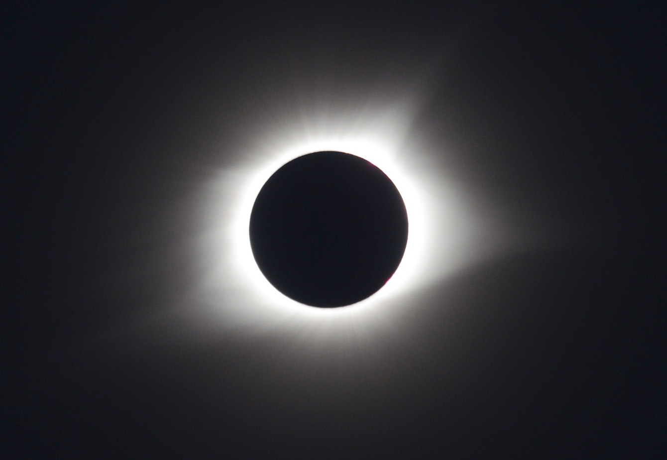 total eclipse - what looks like a black circle outlined in white radiating light
