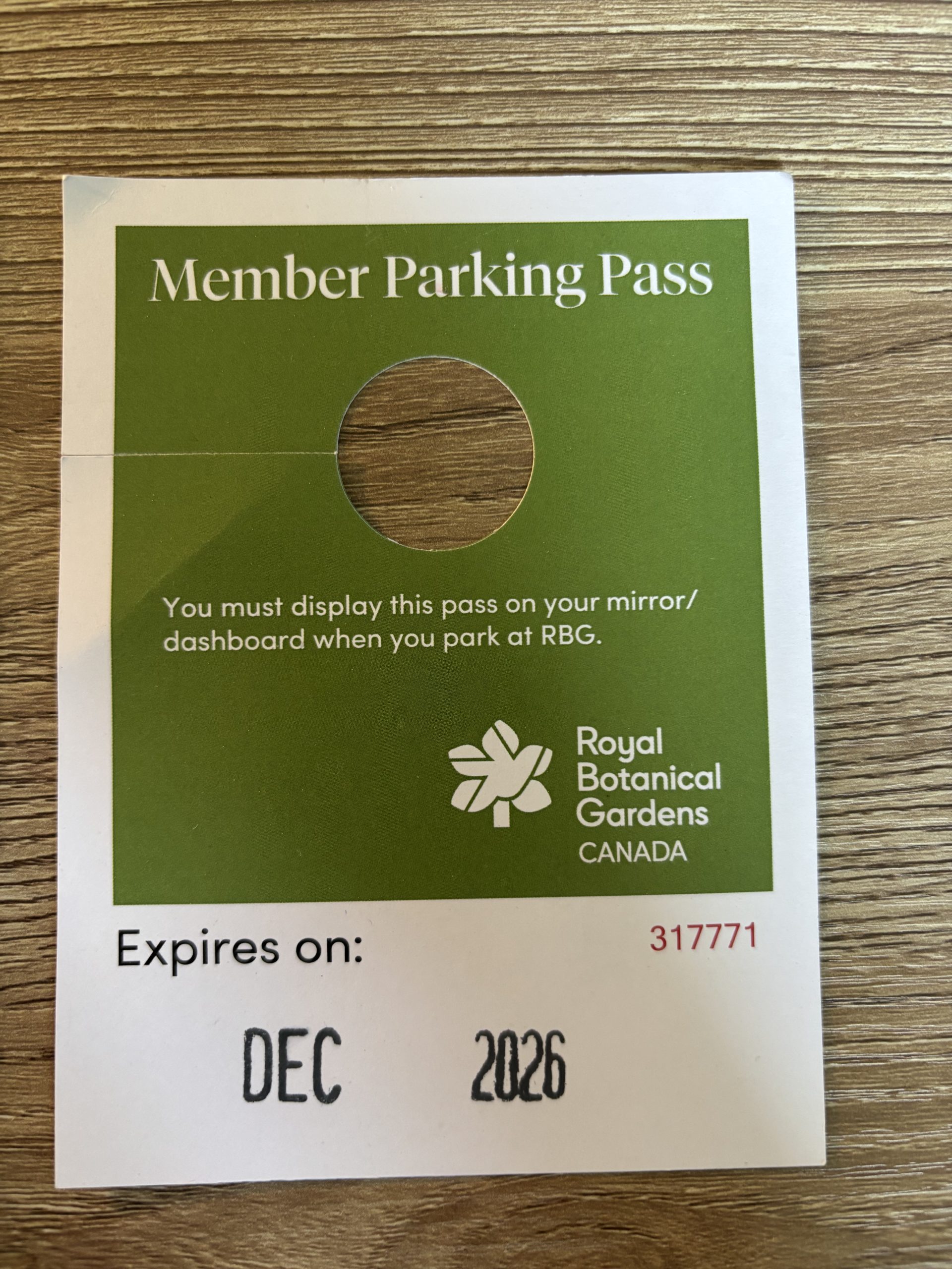 hang parking pass Paper parking pass for use hanging from a rearview mirror, date stamped at the bottom